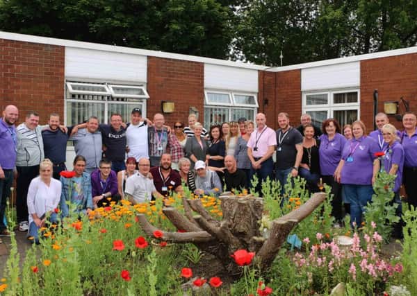 Service users, their families and Aspire staff at New Beginnings