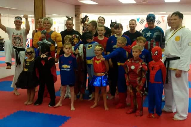 Members of the Lynx Academy dressed as superheroes for training to help support the Mayor of Retford's charity