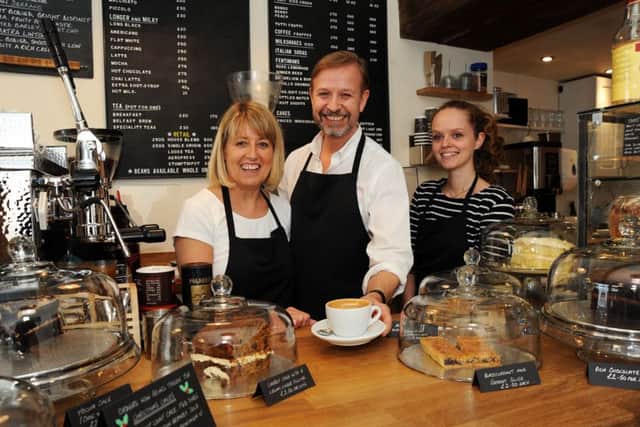 Gail and Tony Brammer with Kyra Lacey in Piccolo's Coffee Shop on Bridge Street, Worksop.