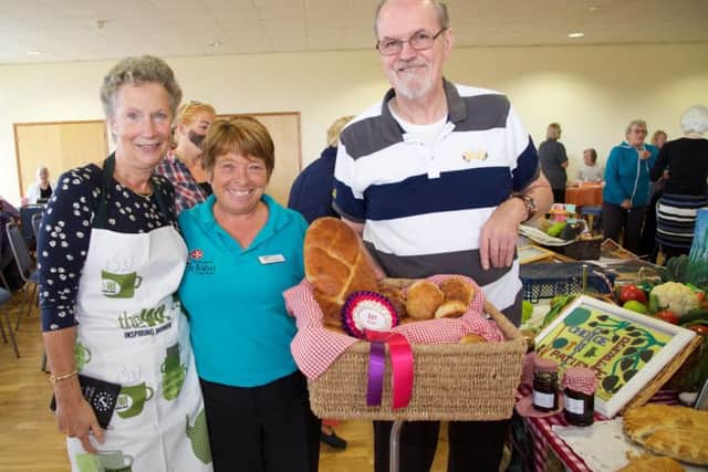 Foxby Court resident Michael Hill, Bev Cowley, activities co-ordinator with Janis Tunaley, marketing manager