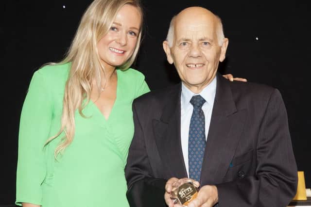 Pictured is Barrie Smith with Hollie Dawson, from award sponsors Holt Doctors.