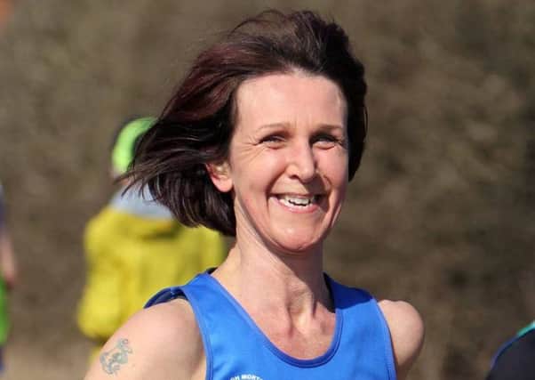 CARRY ON RUNNING! -- plucky Gainsborough Strider Karen Creed, who ran 6k of a 10k race in Nottinghamshire without realising she had dislocated her shoulder in a fall.