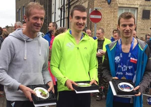 POPPY POWER -- the Striders trio who took second place in the Brigg Poppy 10k. From left, Ronnie McWilliam, Mat Huteson and James Croft. (PHOTO BY: Craig Ward)