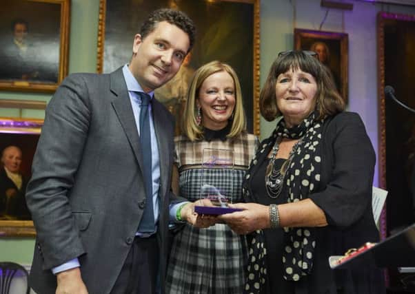 Edward Timpson MP and Clare Grogan presenting the award to Anne Johnson (right) team manager for the council's adoption team.