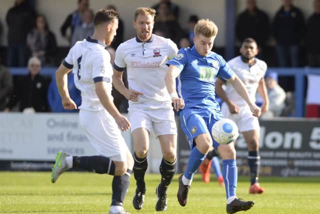 Gainsborough Trinity's Jordan Thewlis (blue).