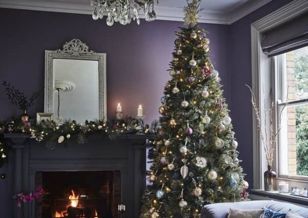 Gowan gold glitter tree, 1.5 metre, from Â£99.99; gold metal leaf decoration, Â£2.99; other baubles from Â£2.99 each, available from Dobbies. Picture credit: PA Photo/Handout.