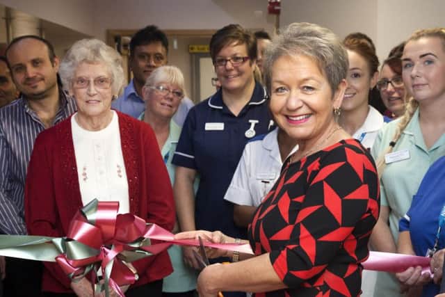 Dame Rosie Winterton MP is pictured cutting the ribbon at the opening.
