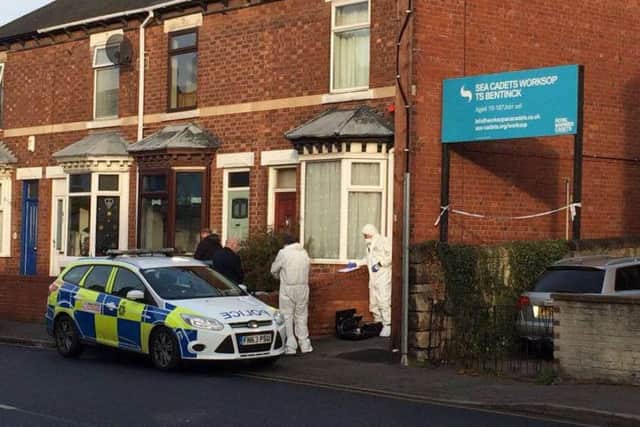 Police investigate the scene of the incident.