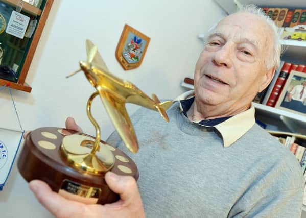 Proud Bill Warwick with the Spitfire Trophy that honoured his research for the Royal Observer Corps Association.