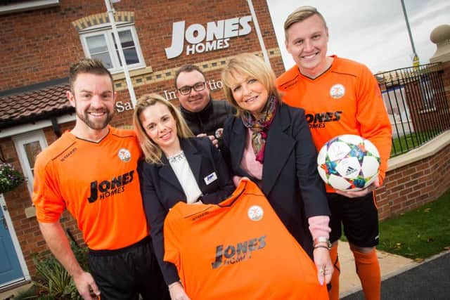 Kelly and Dinah from Jones Homes with members of Harworth Colliery FC; James Woodward, Jonathon Wilson and Ryan Paczkowski.