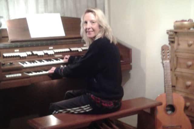 Fiona Law with the church organ she brough back from Port Talbot