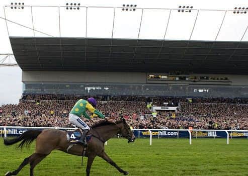 Kauto Star strides to one of his record-breaking five victories in the King George VI Chase at Kempton Park.