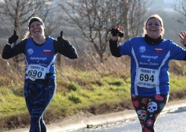 Striders Sam Garrison and Sian Turner on the final climb in the Ferriby 10-Mile race. (PHOTO BY: Lottie Lindley).