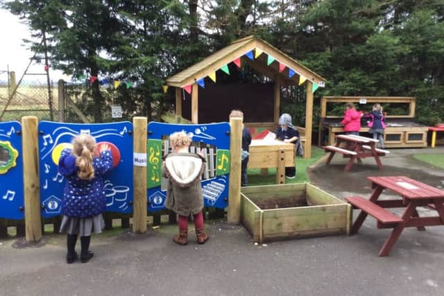 Youngsters enjoying the new outdoor play area at Sturton Cygnets Preschool.
