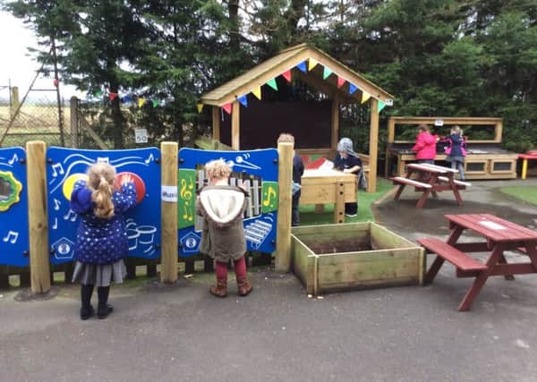 Youngsters enjoying the new outdoor play area at Sturton Cygnets Preschool.
