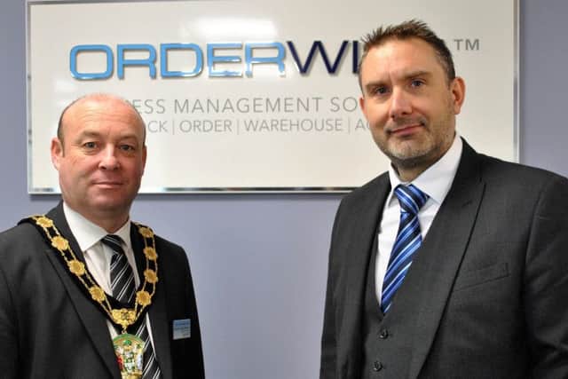 West Lindsey District Council Chairman Roger Patterson with David Hallam, Director at OrderWise at the company's Saxilby headquarters.