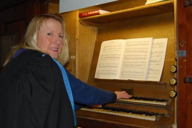Fiona Law, organist at All Saints in Misterton, at the keyboard of the church's historic organ