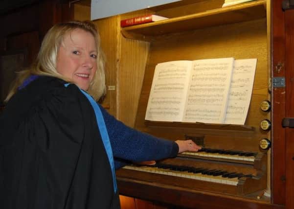 Fiona Law, organist at All Saints in Misterton, at the keyboard of the church's historic organ