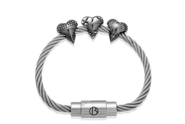 The three stainless steel heart-shaped 3D printed bead designs on a CABLE bracelet.