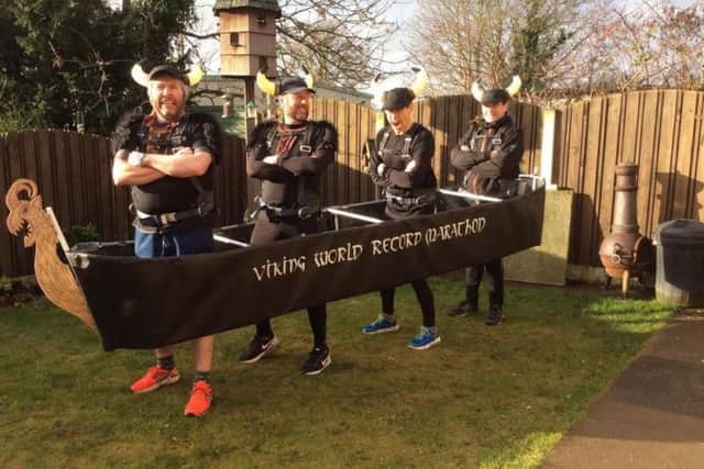 Martin Ward, Nigel Burton, Steve Tait and Chris Gale are attempting to become the first team to complete the Edinburgh marathon in a four-person costume, complete with real beards, shields and lots of snarling.