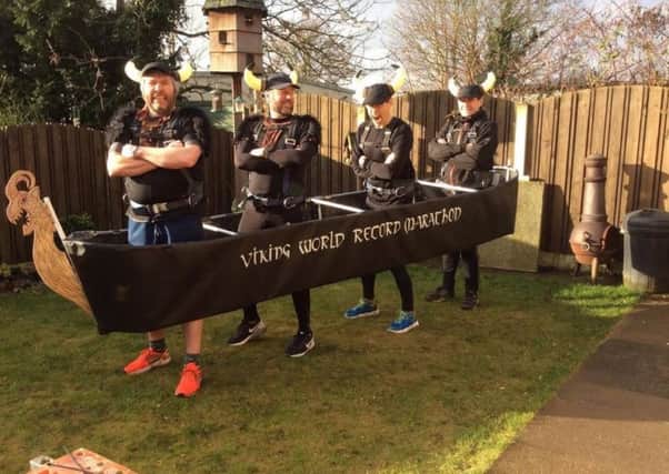 Martin Ward, Nigel Burton, Steve Tait and Chris Gale are attempting to become the first team to complete the Edinburgh marathon in a four-person costume, complete with real beards, shields and lots of snarling.