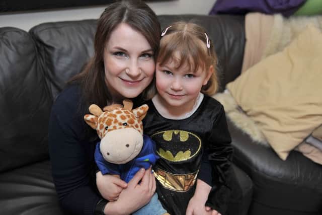 Sarah Bell will be running the London Marathon to raise funds for the Tuberous Sclerosis Association dressed in a Batman costume. Sarah is pictured with Daughter Emily, four