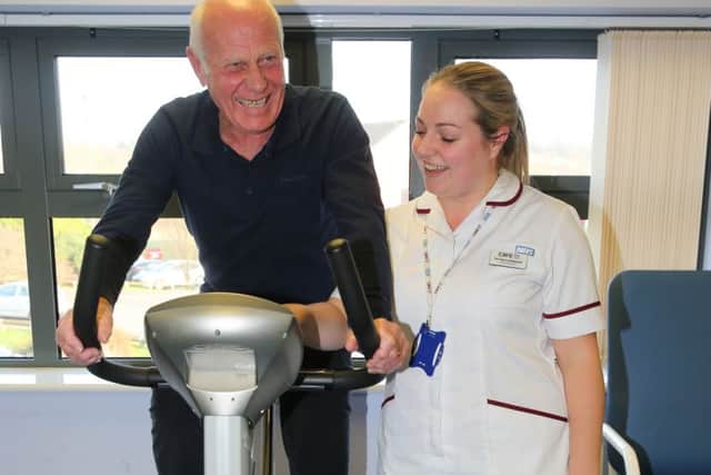 Giuseppe Ferrarelli on a bike with physiotherapist, Nicole Lockwood