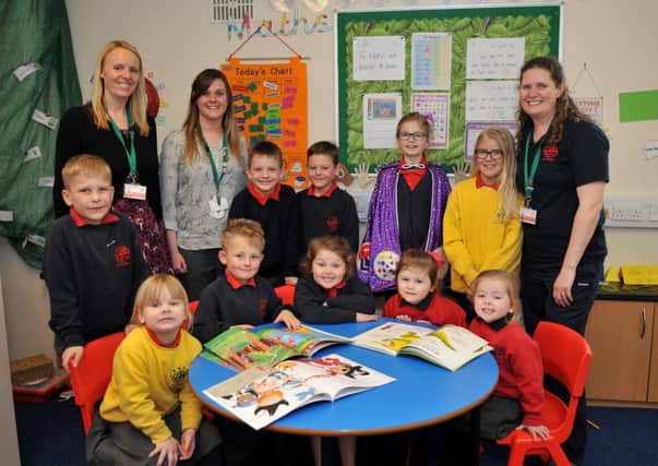 Staff and children at St George Primary School Gainsborough celebrate their Good Ofsted report, pictured are deputy head Holly Ruddlesdin, Keystage 2 leader Katy Vaux and Inclusion manager Kate Collins with children