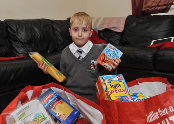 Local boy Dylan Cookson, seven, has been busy collecting for Bassetlaw Food Bank