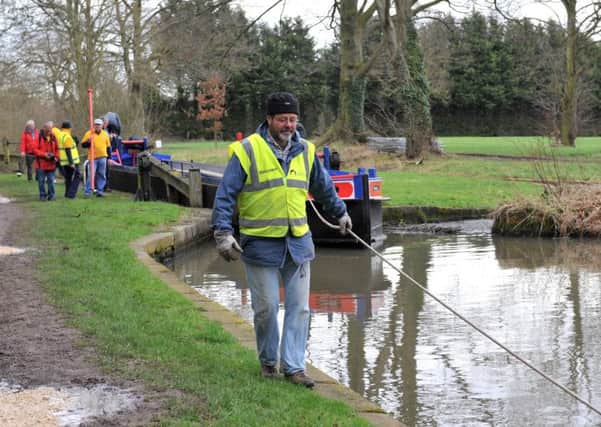 Volunteers pull barge containing new lock gates which are due to be fitted on the Chesterfield Canal near Shireoaks