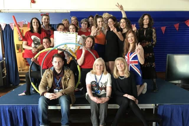Teachers, teaching assistants and office staff with guest judges Councillor Joanna White, former teacher Mrs Wilson- Carr and site manager Janet Medlam