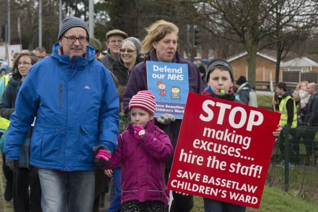 A recent protest against the cuts.