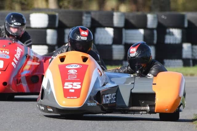 Team SAS, alias sidecar-racers Giles and Jen Stainton, in action on the track. (PHOTO BY: Sid Diggins)