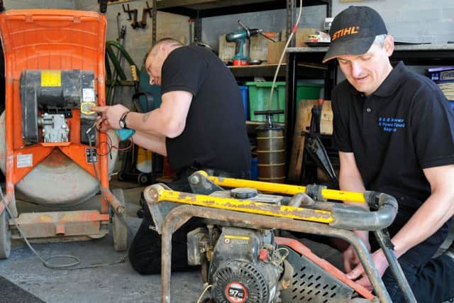 Steven Barlow, right and Lee Booth who have set up B and B Mover and Power Tool Repairs at work in their Carlton House workshop.