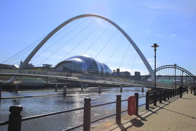 View from the Quayside towards the Gateshead Millennium Bridge, The Sage Gateshead and The Tyne Bridge.