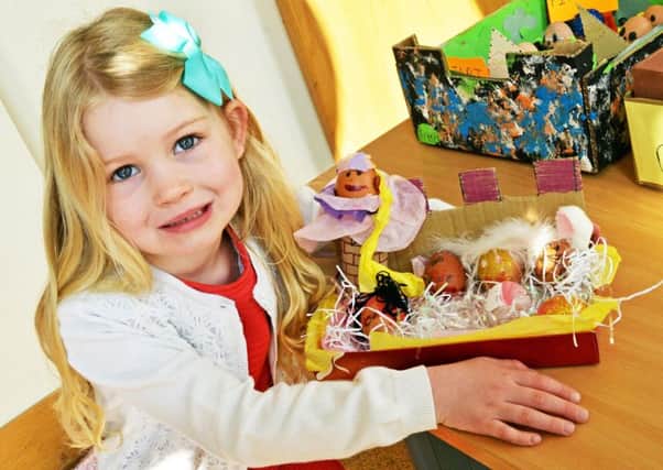 Ella Tune, four, pictured with her Rapunzel themed decorated egg. Picture: Marie Caley NEPB Easter MC 3