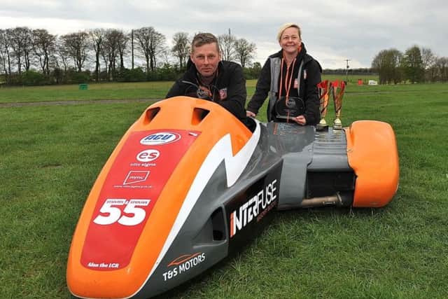 Sidecar-racing team Giles and Jen Stainton, fresh from their well-deserved victory at Cadwell Park (PHOTO BY: Sid Diggins).