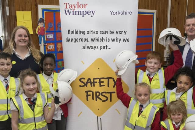 Pictured at St Joseph's Catholic Primary School, Bevan Av, Rossington Doncaster South Yorkshire
where Taylor Wimpey's Keith Chester & Assistant Site Manager from Holly Inn Emma , visited the School to give the Pupils a health & Safety Talk. on 21st March 2017