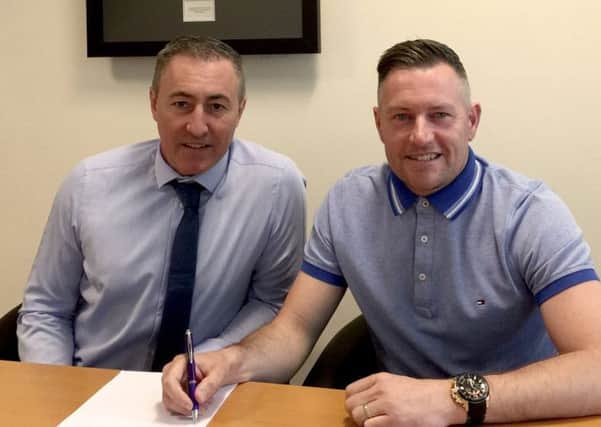 Gainsborough Trinity chairman Richard Kane and manager Dave Frecklington as he signs a new two-year deal. PHOTO: Gainsborough Trinity