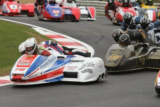 Nev Jones and Tom Bryant in sidecar-racing action.