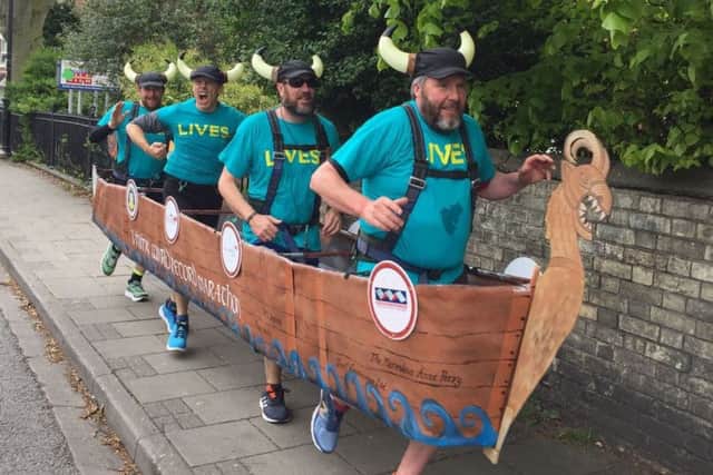 The runners, dressed as a Viking longboat, take to the streets of Gainsborough as part of their final warm-up for the world-record attempt.