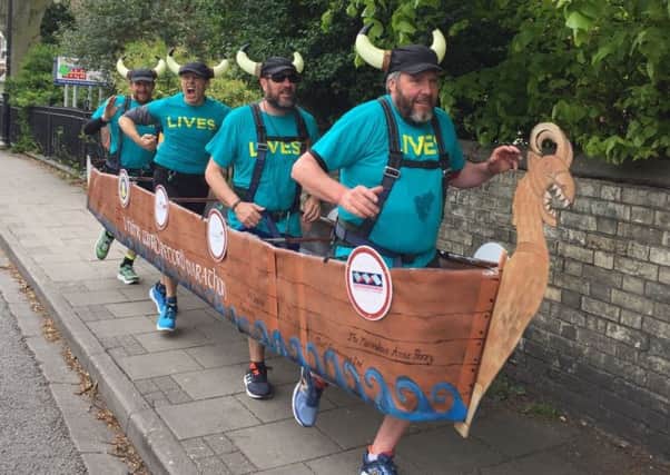 The runners, dressed as a Viking longboat, take to the streets of Gainsborough as part of their final warm-up for the world-record attempt.