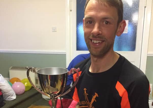 Proud Jerry McCulla with his trophy after winning the Hardmoors 200-mile ultra marathon from Hull to Helmsley.