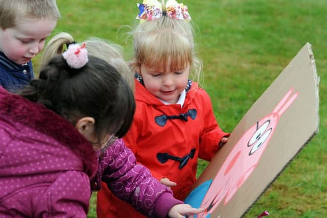 Pupils from the Priory Academy spot their favourite Peppa Pig characters during a puddle walk following their picnic to raise funds for the Wish Upon a Star charity, on Friday.