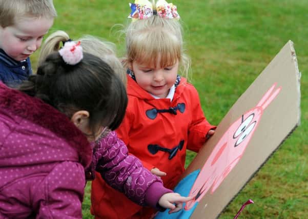 Pupils from the Priory Academy spot their favourite Peppa Pig characters during a puddle walk following their picnic to raise funds for the Wish Upon a Star charity, on Friday.