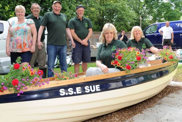 Eastoft Gardening Club are using a boat as a flower planter on High Street, Eastoft.