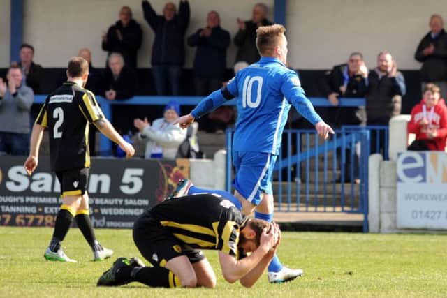 Nathan Jarman celebrates a goal for Trinity.