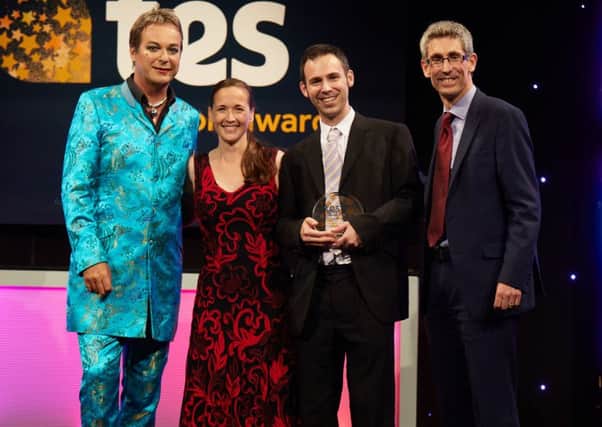 Stewart Cook and Ali Kershaw receive the award for the school from Mark Herbert (right) of the British Council and event host Julian Clary