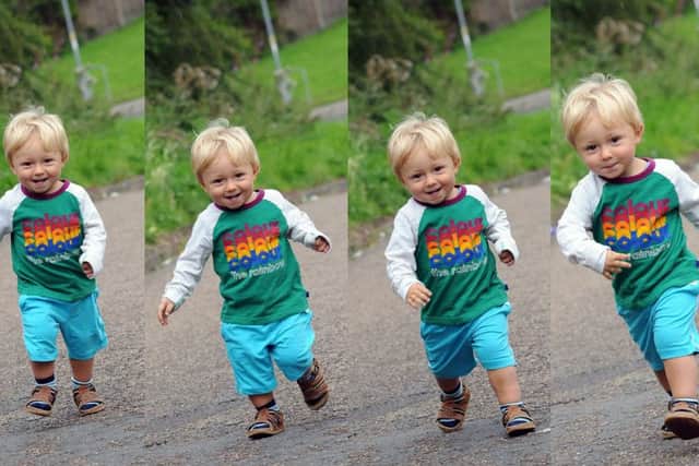 One year old Marshall Tyrell makes progress on his 1 mile walk in aid of JOEL.
