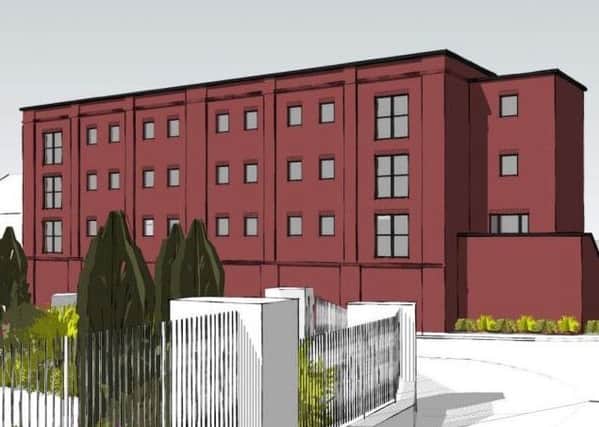 An architect drawing showing the view from Station Approach and the new apartment
building. Image submitted.